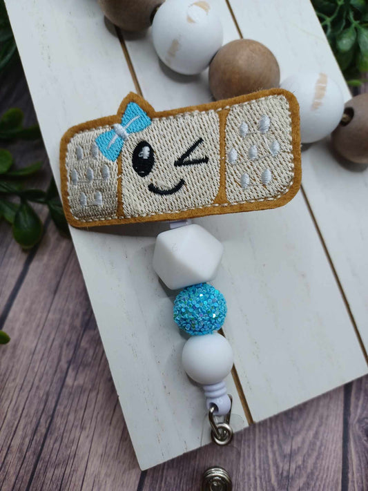 Embroidered Winking Bandaid Beaded Retractable Badge Reel