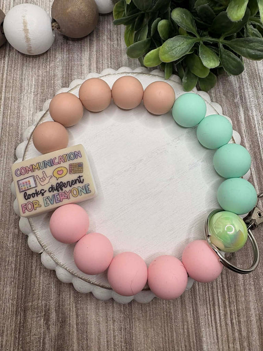 Communication looks different For Everyone Beaded Wristlet - Tan, Pink, Teal