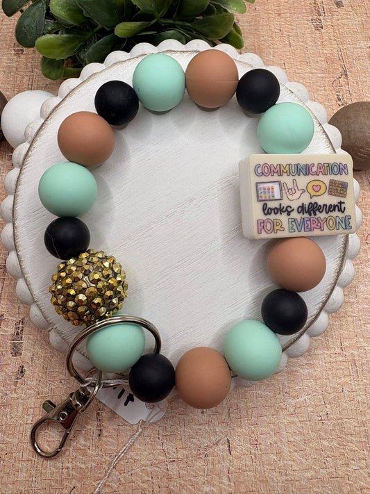Communication looks different For Everyone Beaded Wristlet - Black, Teal, Tan