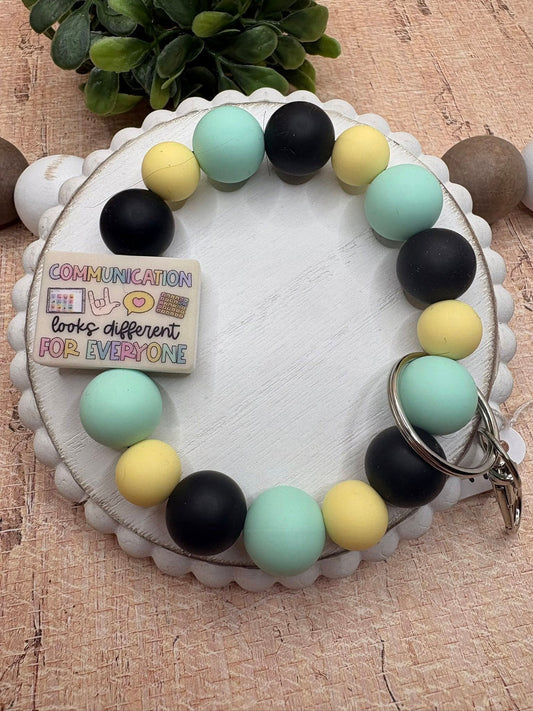 Communication looks different For Everyone Beaded Wristlet - Teal, Yellow, Black