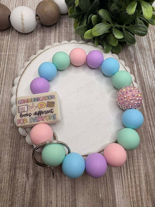 Communication looks different For Everyone Beaded Wristlet - Purple, Blue, Teal