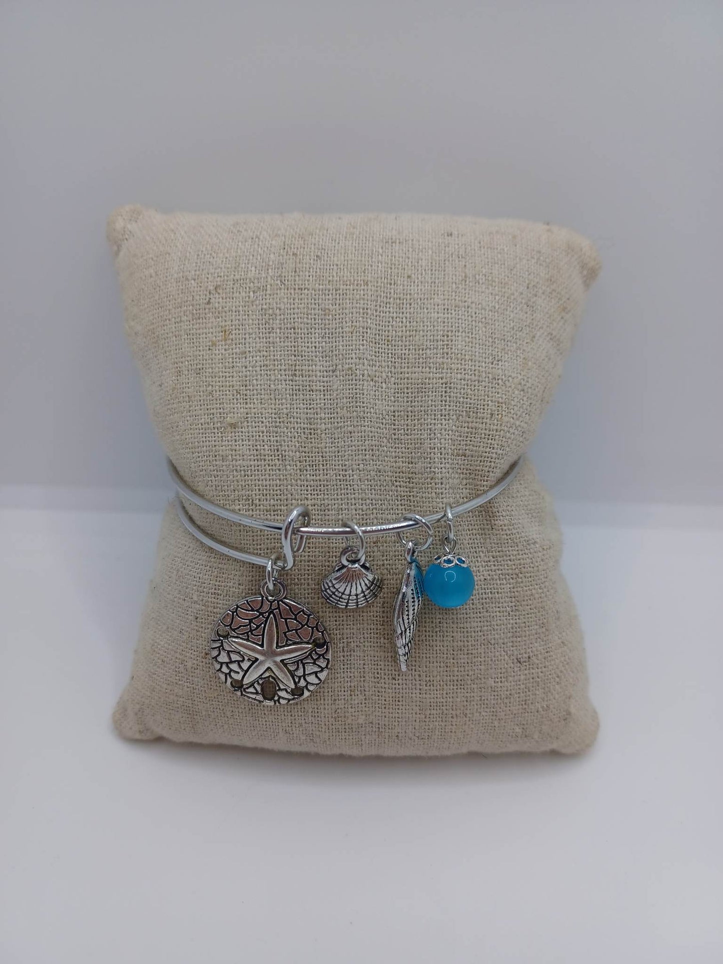 Beachy Themed Bracelet w/ Sand Dollar Sea Star, Shell, & Blue Charms