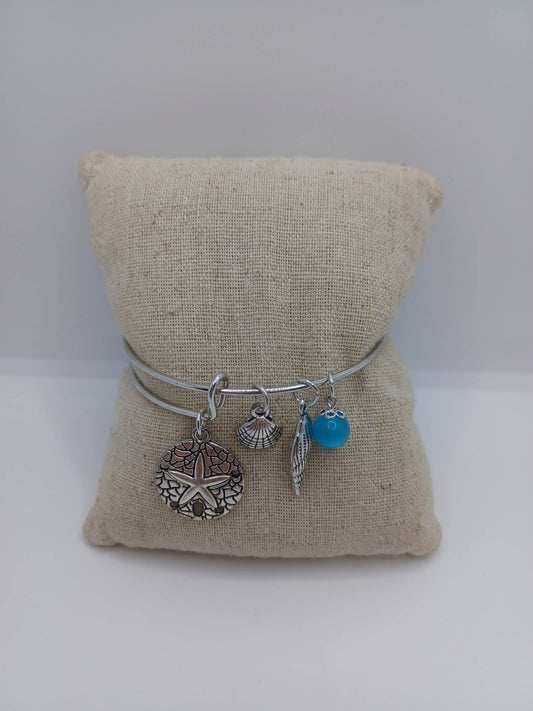 Beachy Themed Bracelet w/ Sand Dollar Sea Star, Shell, & Blue Charms