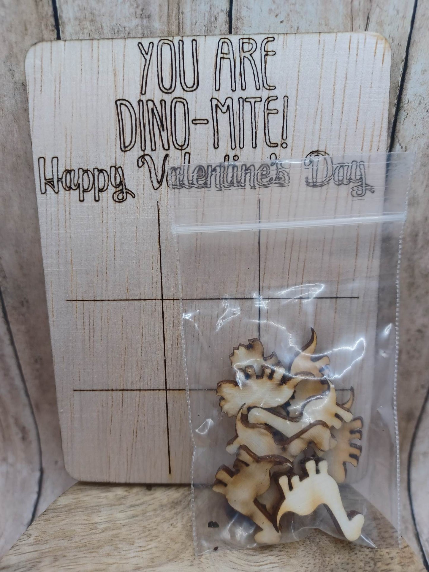 You are Dino-Mite Tic Tac Toe Game - Comes with Dino Tic Tac Toe Pieces