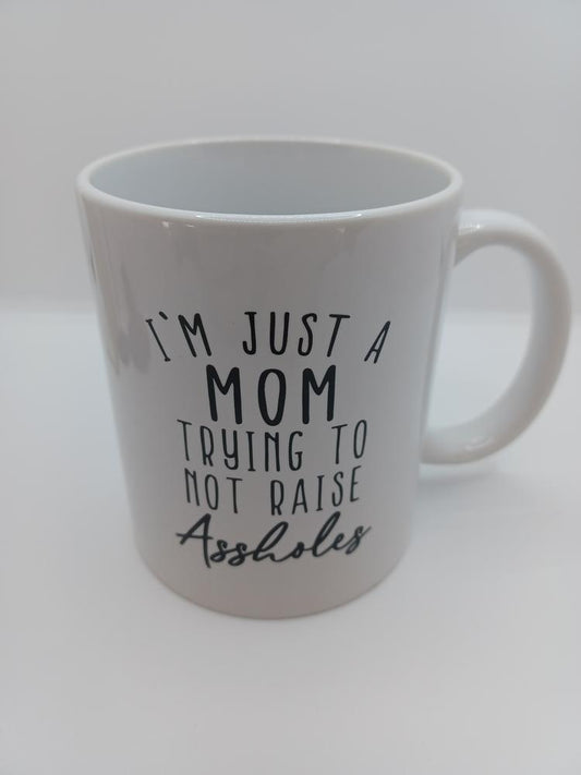 I'm Just a Mom Trying Not to Raise Assholes Coffee Mug