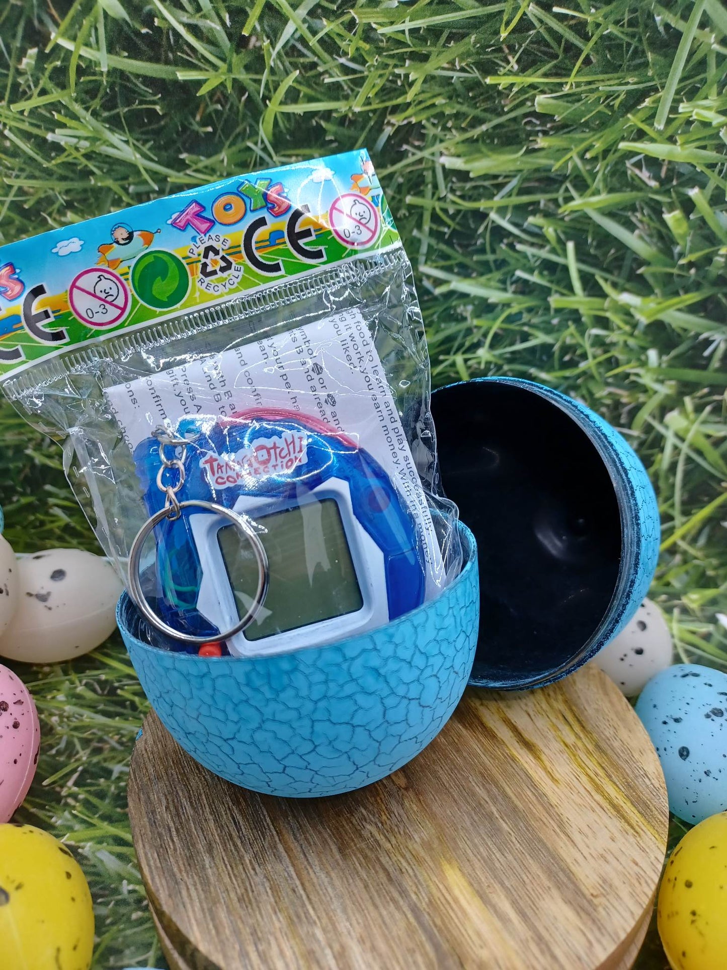 Blue Handheld Pet on a Keyring in an Egg