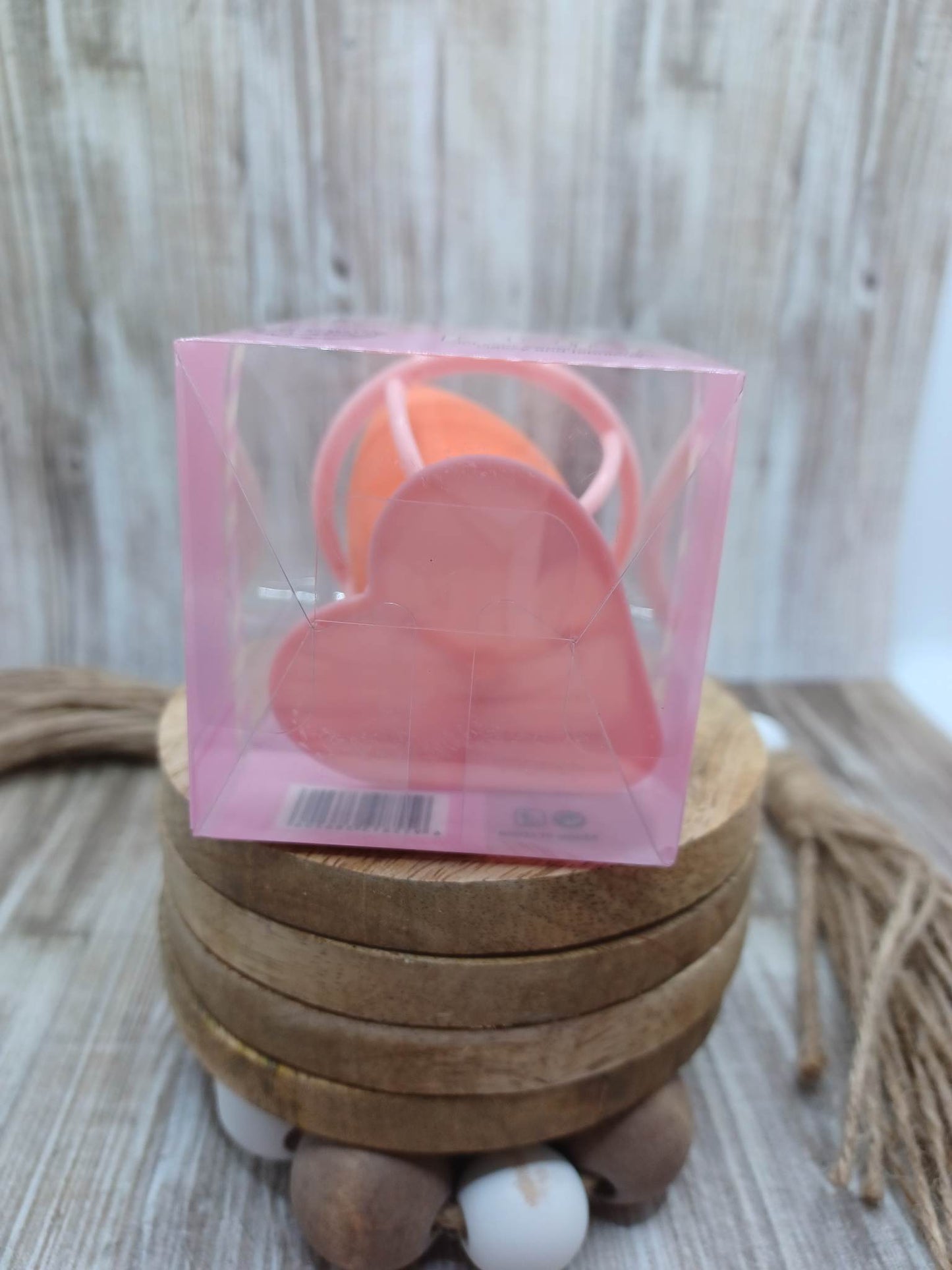 Orange Beauty Blender in a Heart Stand