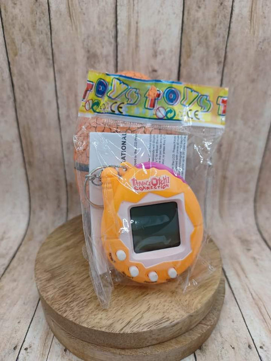 Orange Handheld Pet on a Keyring in an Egg
