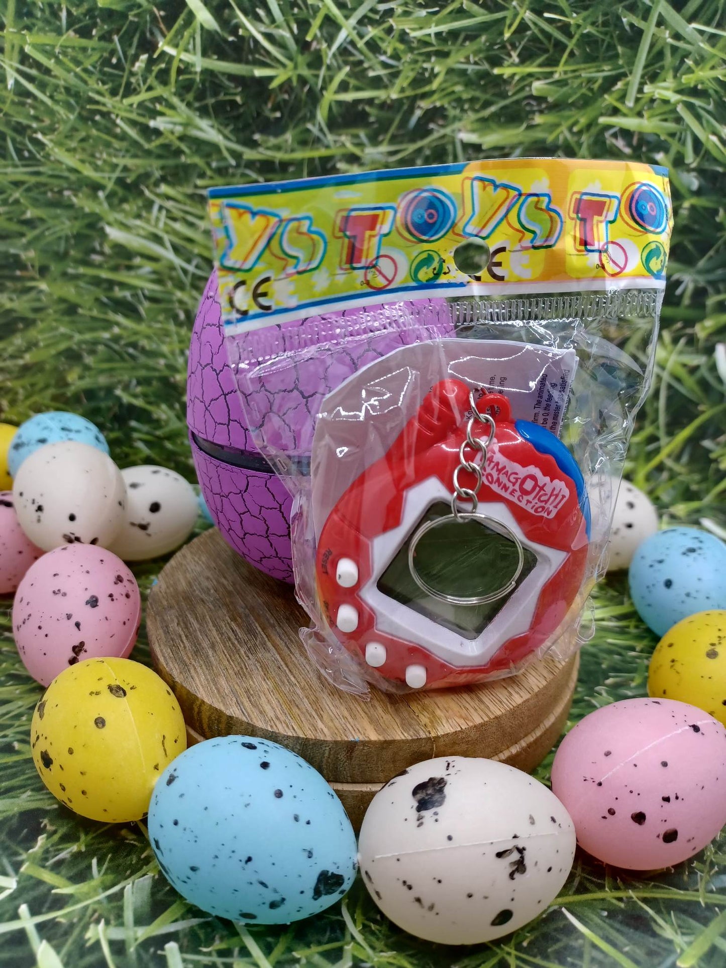 Purple Handheld Pet on a Keyring in an Egg