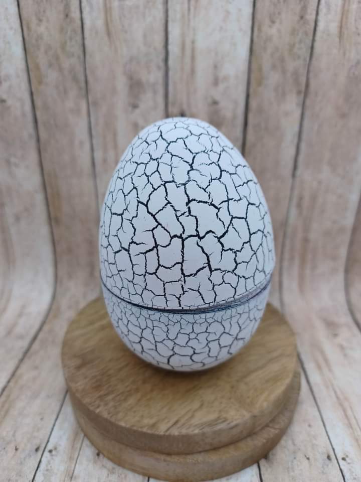 White Handheld Pet on a Keyring in an Egg