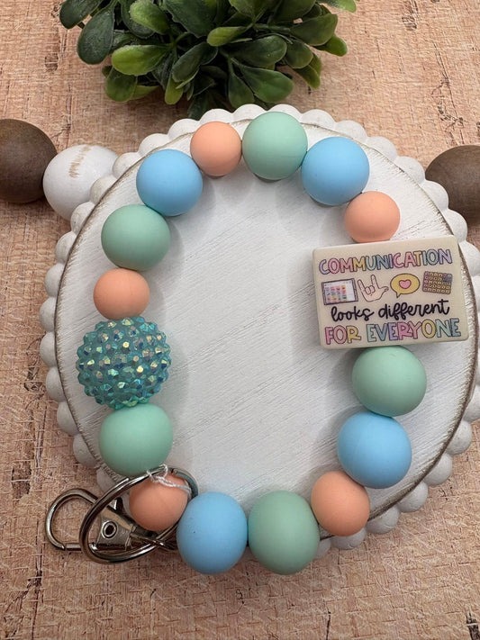 Communication looks different For Everyone Beaded Wristlet - Tan, Teal, Blue